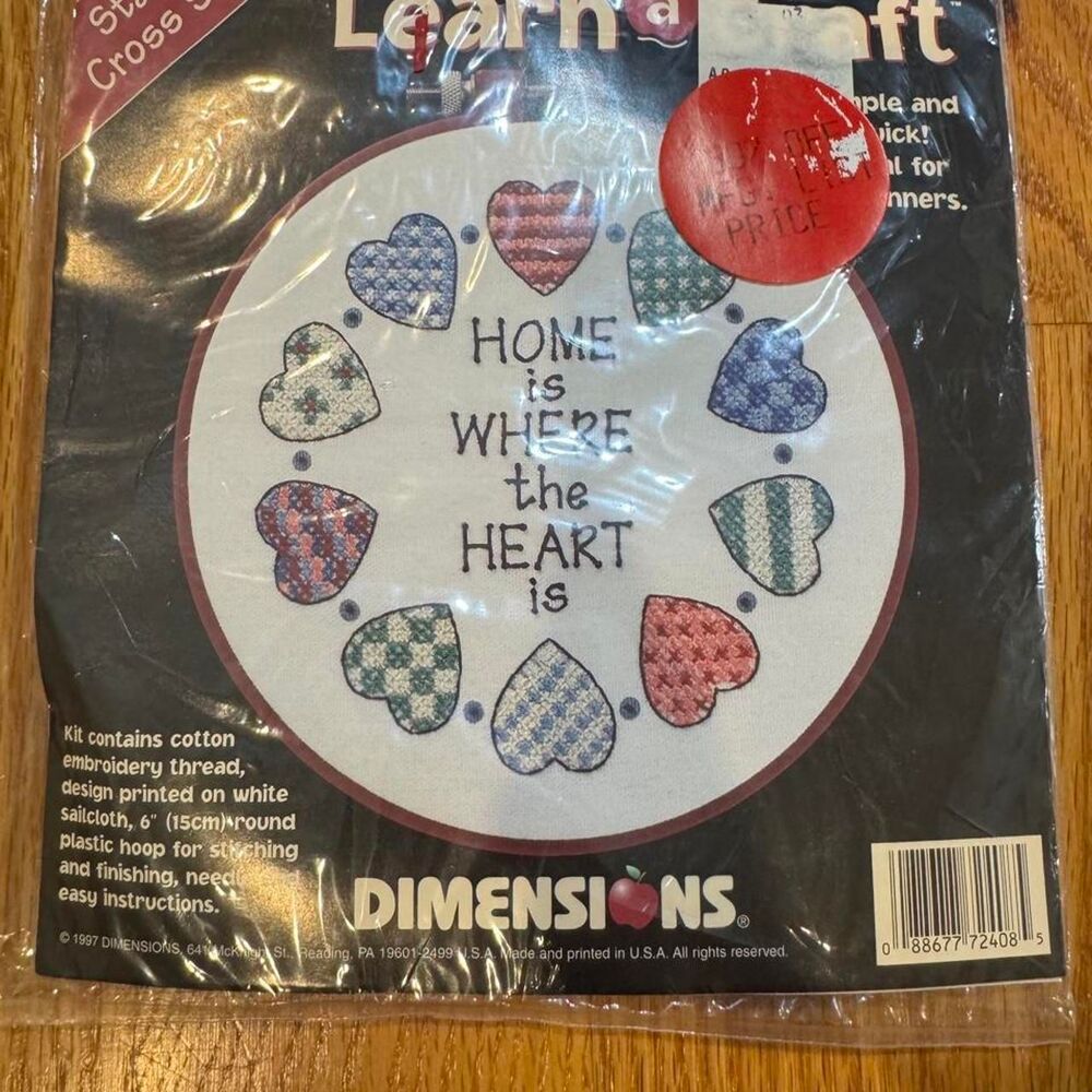 Dimensions cross stitch kit with hearts and the words 'HOME is WHERE the HEART i